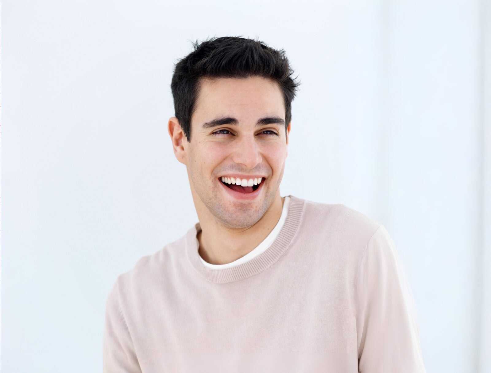 A man laughing warmly